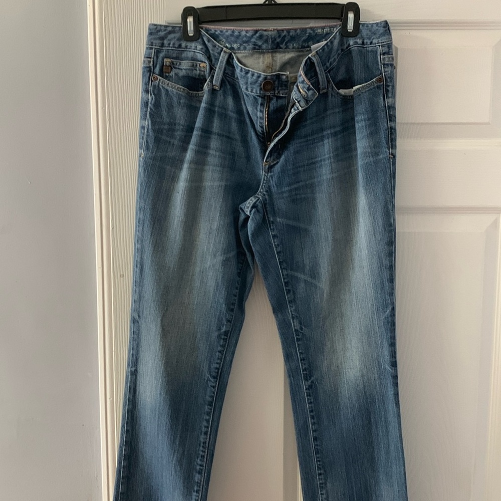 Distressed blue jeans
